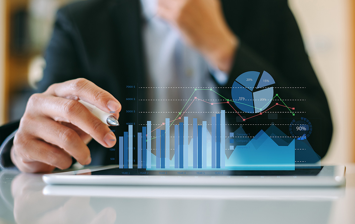 man reviewing graphs