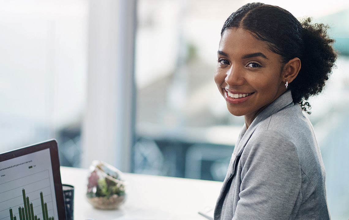smiling woman at computer