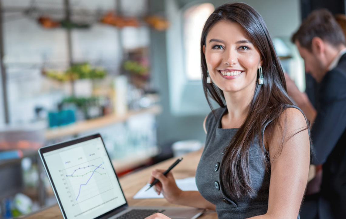 woman with computer smiling