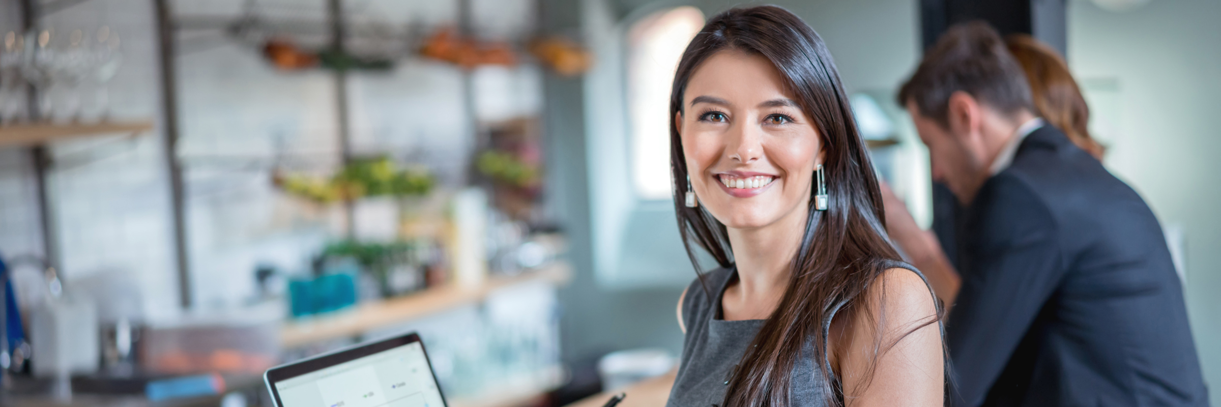 woman with computer smiling