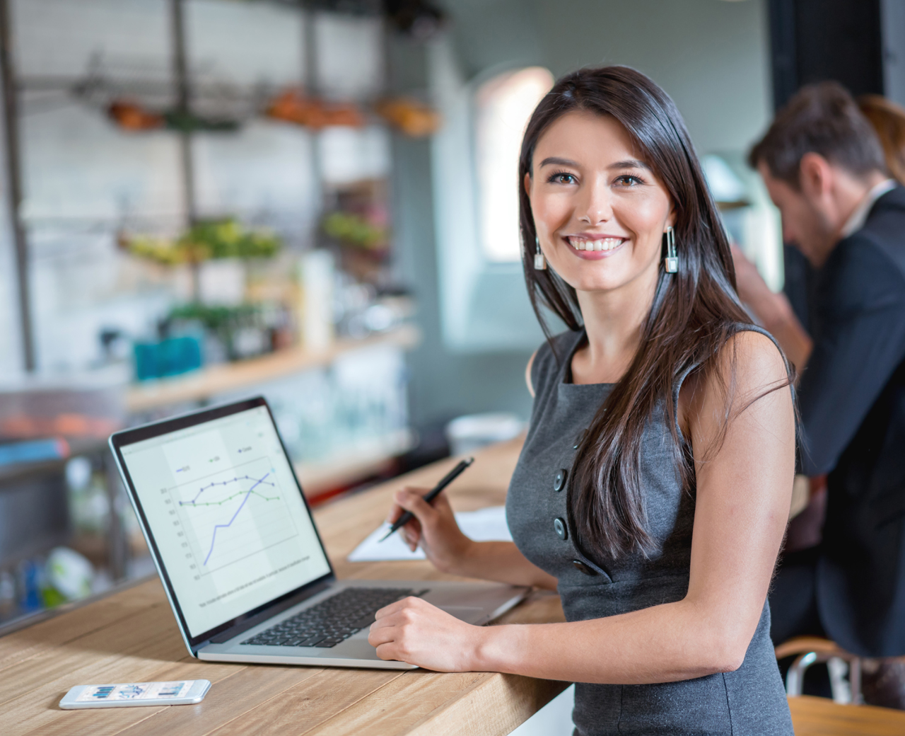 woman with computer smiling