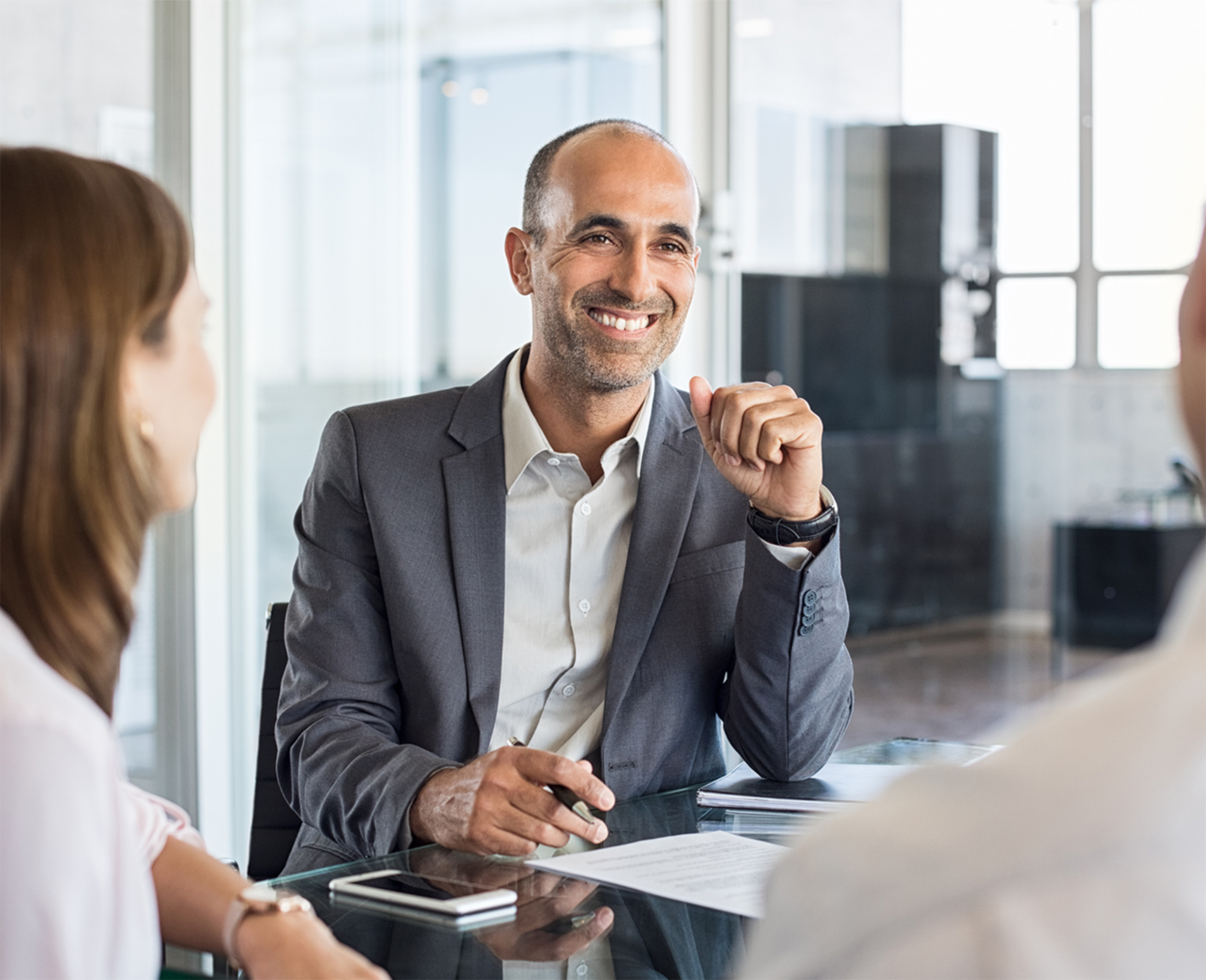 Financial Advisor meeting with a client at the office.