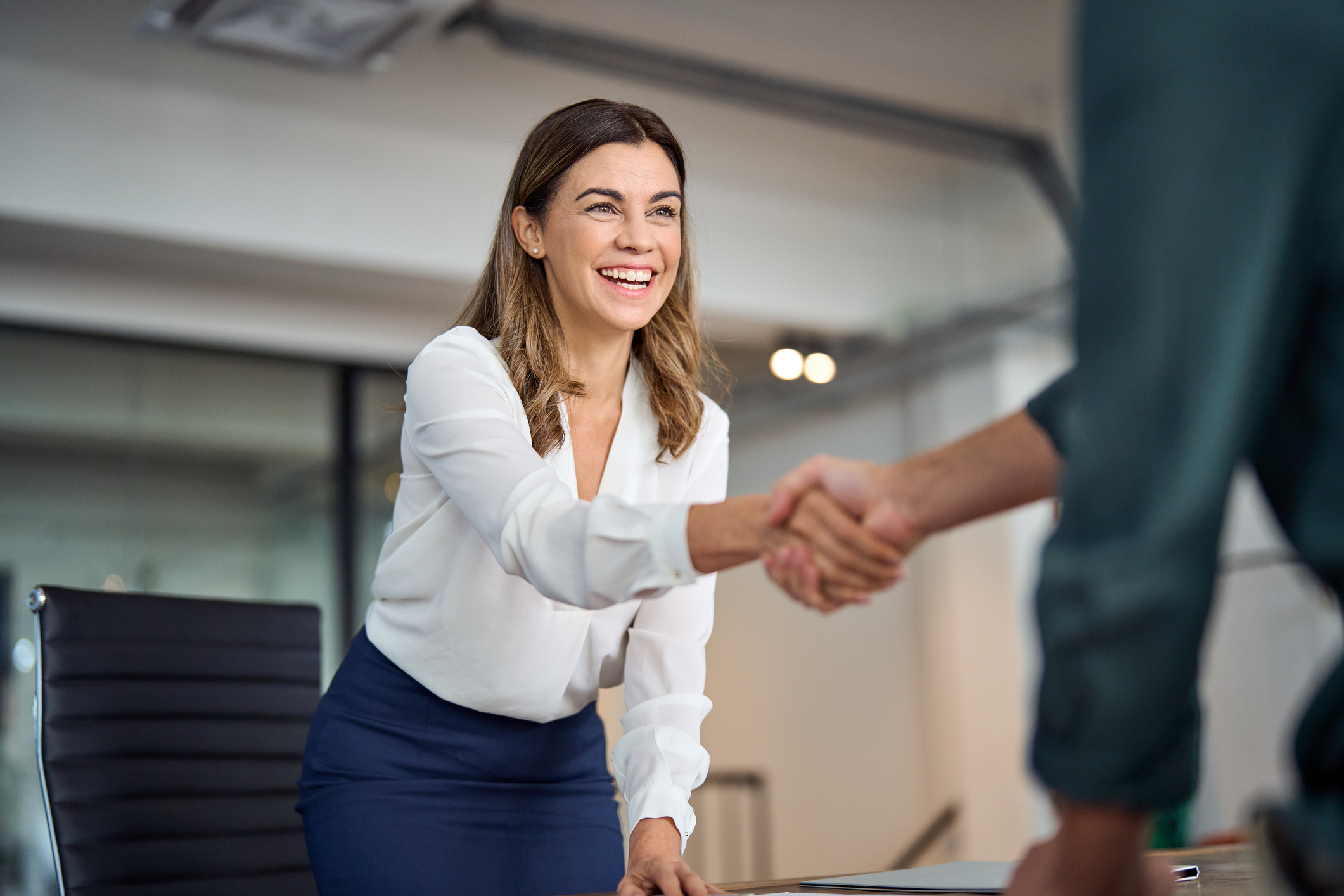 Financial advisor shaking hands with a client