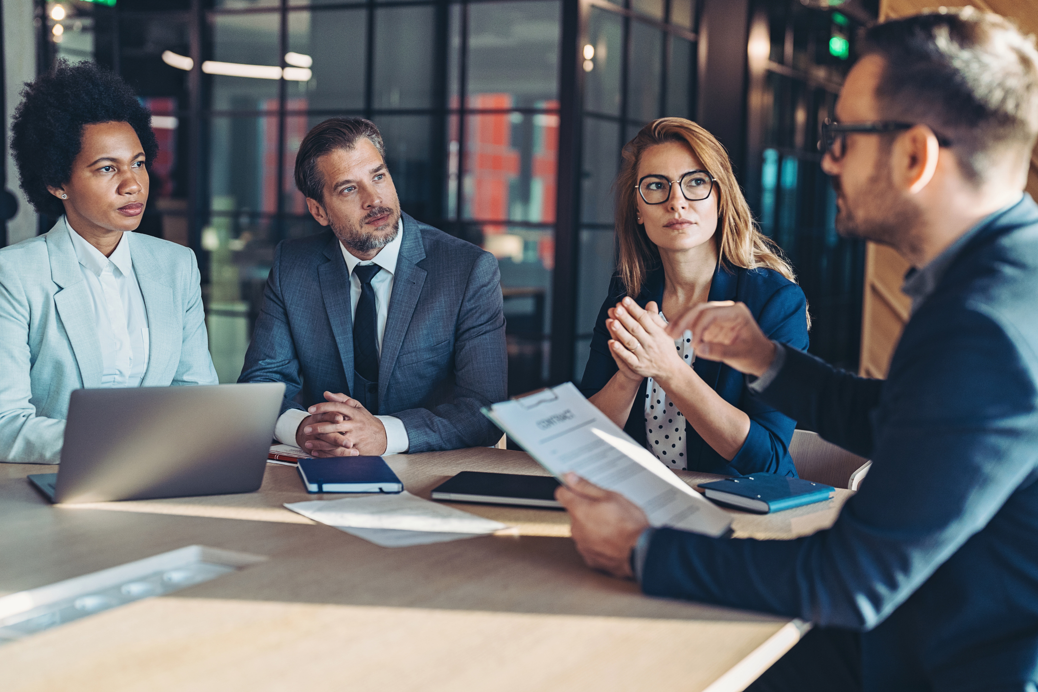 Group of tax professionals discussing how to best maximize their client's taxes