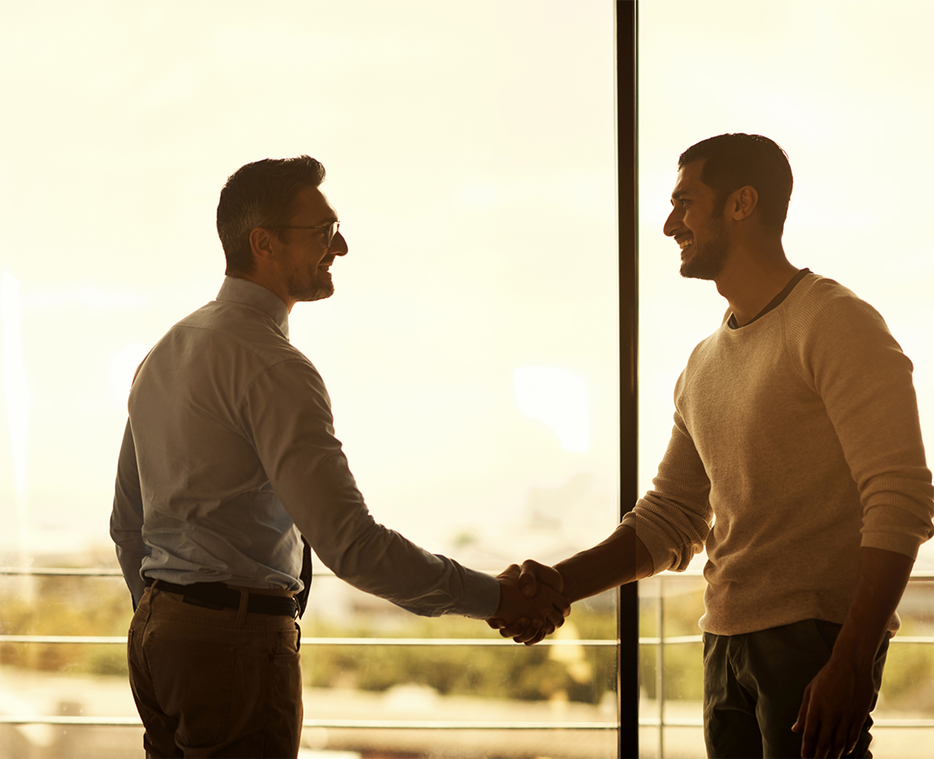 Image of two gentleman shaking hands.