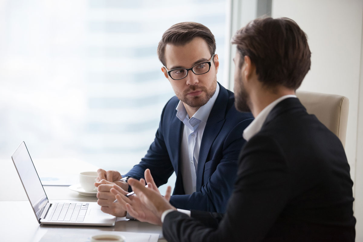 Financial Advisor with client looking at computer