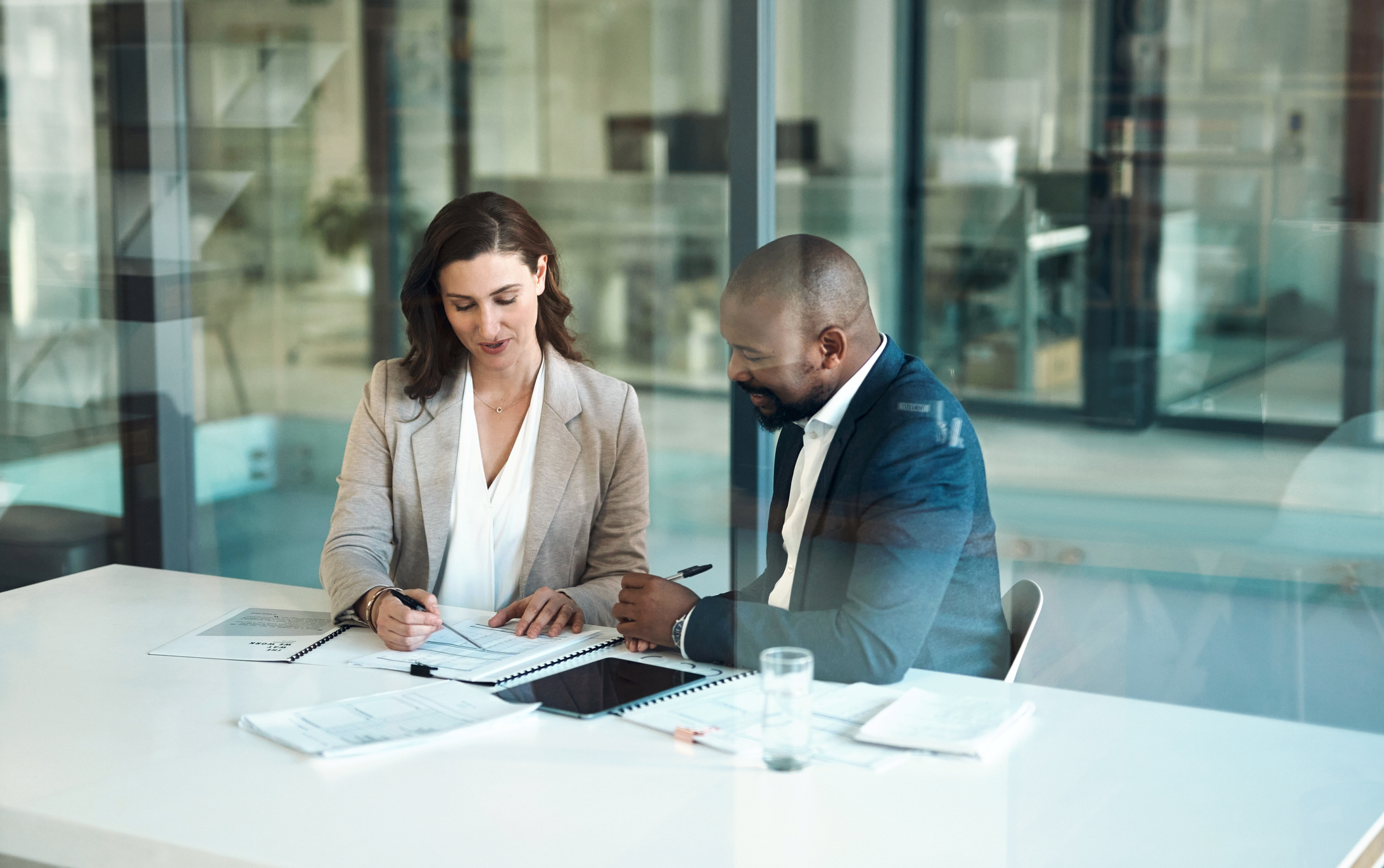 Image of two financial advisors working together for their clients.