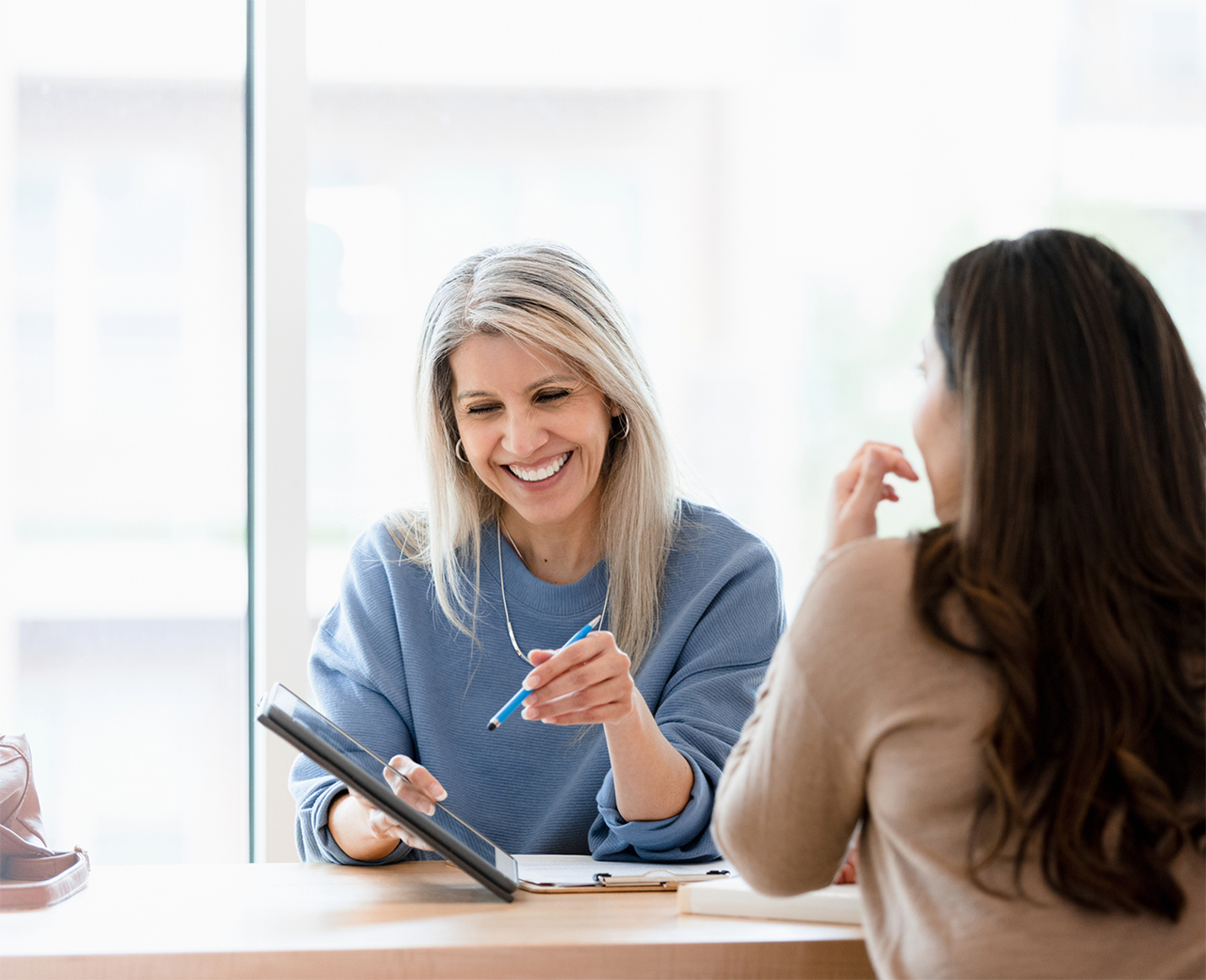 Image of female advisor working with client